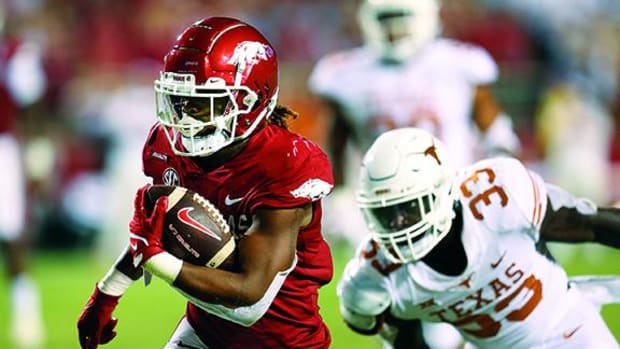 Arkansas Razorbacks running back AJ Green (0) rushes for a touchdown in the second half against the Texas Longhorns at Donald W. Reynolds Razorback Stadium. Arkansas won 40-21.